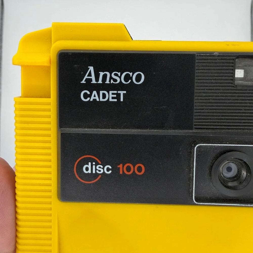 Ansco Cadet Disc 100 Camera with Ansco-Lite F‎ 20 Flash Yellow Vintage 80s Tech